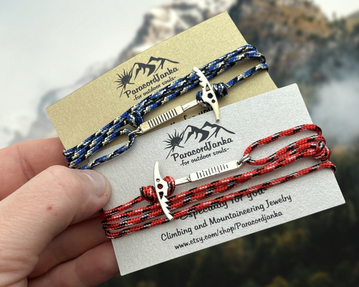 Two climbing bracelets on a card with Paracordianka branding, against a blurred natural background.