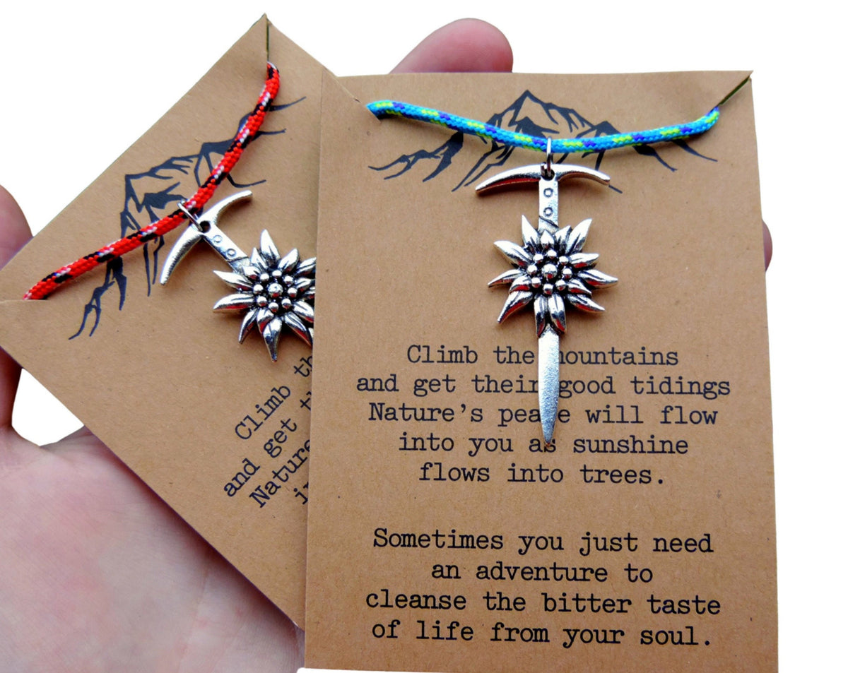 Climbing necklaces with edelweiss on a card with motivational text